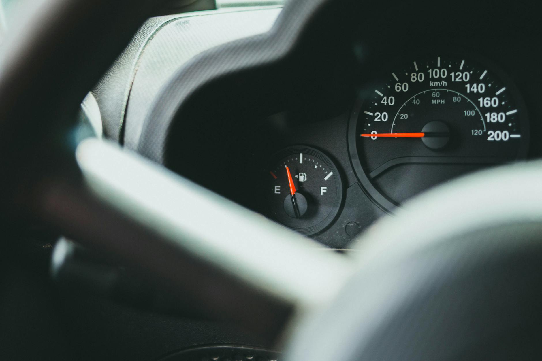 A detailed view of a car's dashboard showing the speedometer and fuel gauge indicators.