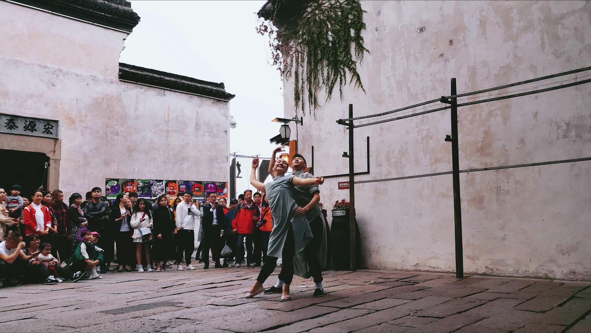 A dynamic street performance captured in an urban setting in Jiaxing, Zhejiang, China.