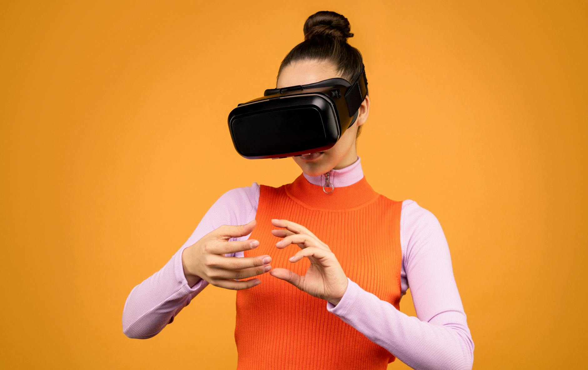 A young woman enjoying an immersive virtual reality experience indoors, wearing a VR headset.