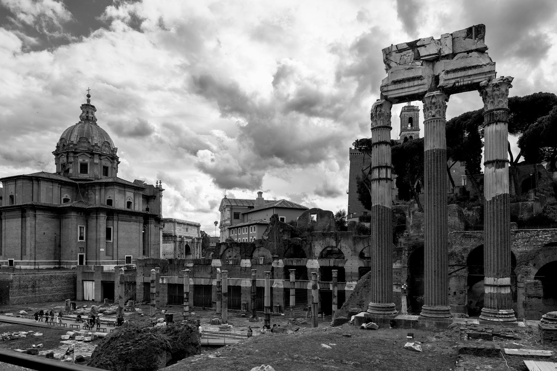 Explore the ancient Roman Forum ruins with Santi Luca e Martina Church in Rome, Italy.