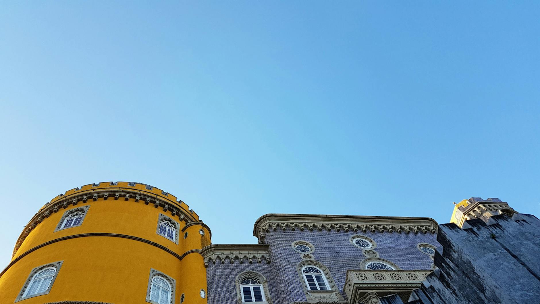 Vibrant view of Pena Palace in Sintra, Portugal showcasing its unique architecture.